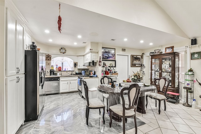 dining area with vaulted ceiling