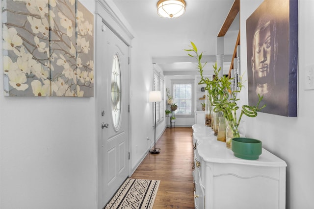 entryway with wood-type flooring