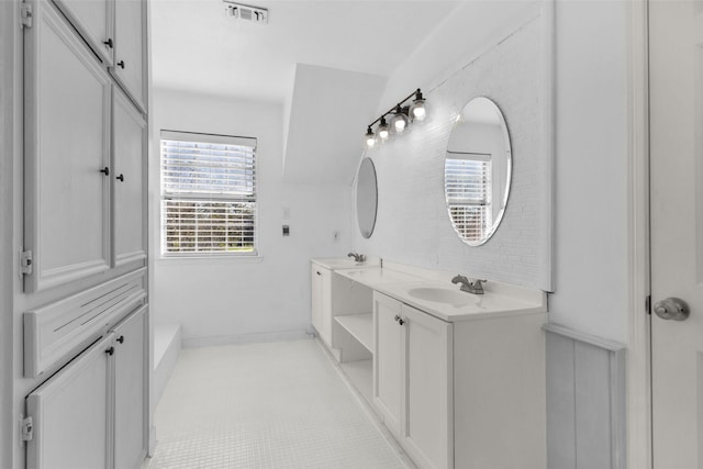 bathroom with tile patterned flooring and vanity