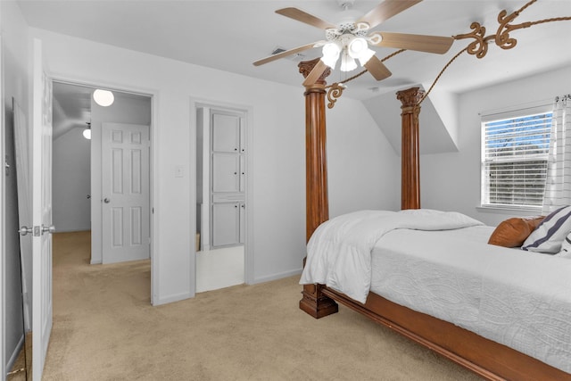 carpeted bedroom featuring ceiling fan and vaulted ceiling