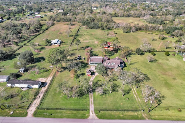 birds eye view of property with a rural view