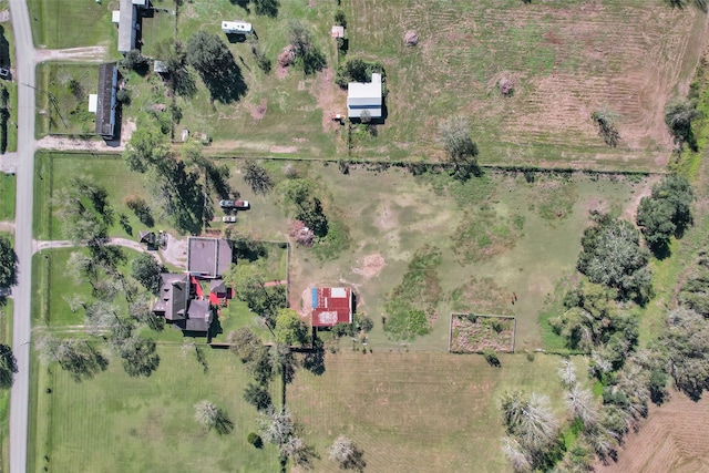 birds eye view of property with a rural view