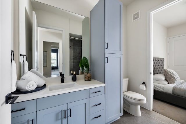 bathroom featuring vanity and toilet