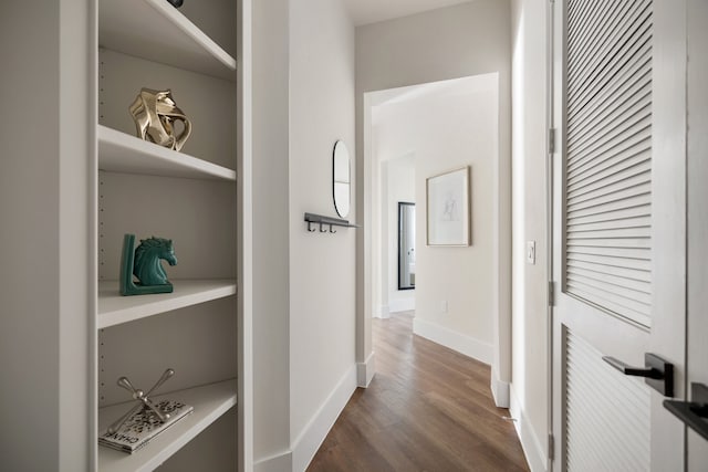 corridor featuring hardwood / wood-style flooring