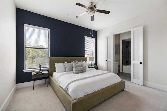 bedroom featuring ceiling fan and light carpet