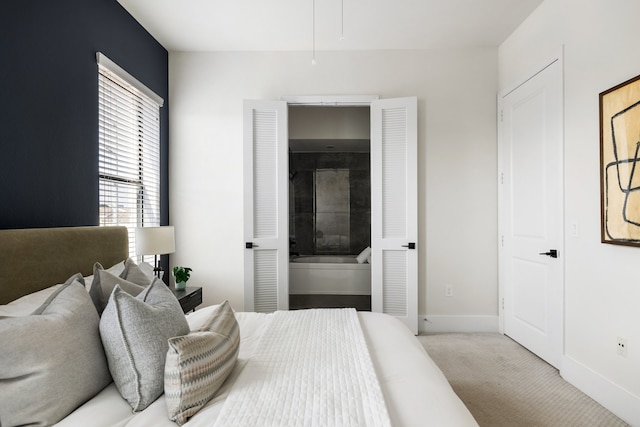 bedroom featuring light carpet and a fireplace