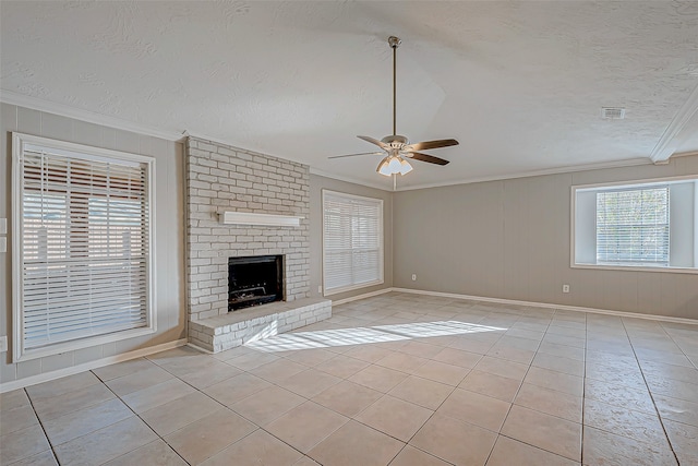 unfurnished living room featuring ceiling fan, light tile patterned floors, and a textured ceiling