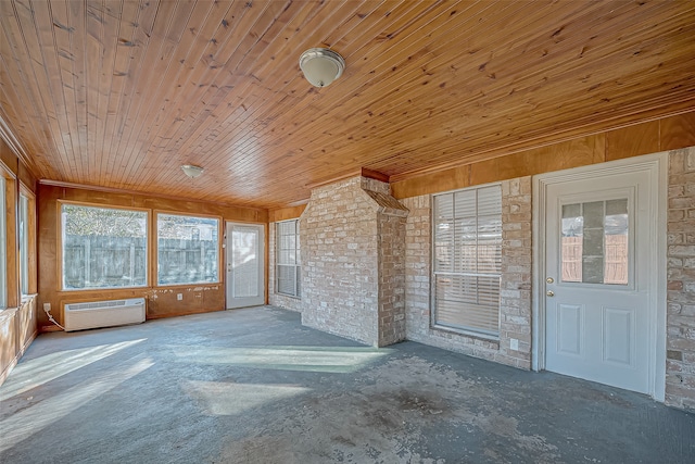 unfurnished sunroom with a wall unit AC and wooden ceiling