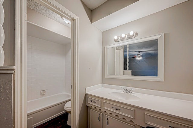 full bathroom with vanity, toilet, and tiled shower / bath combo