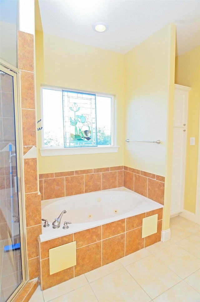 bathroom featuring tile patterned flooring and plus walk in shower