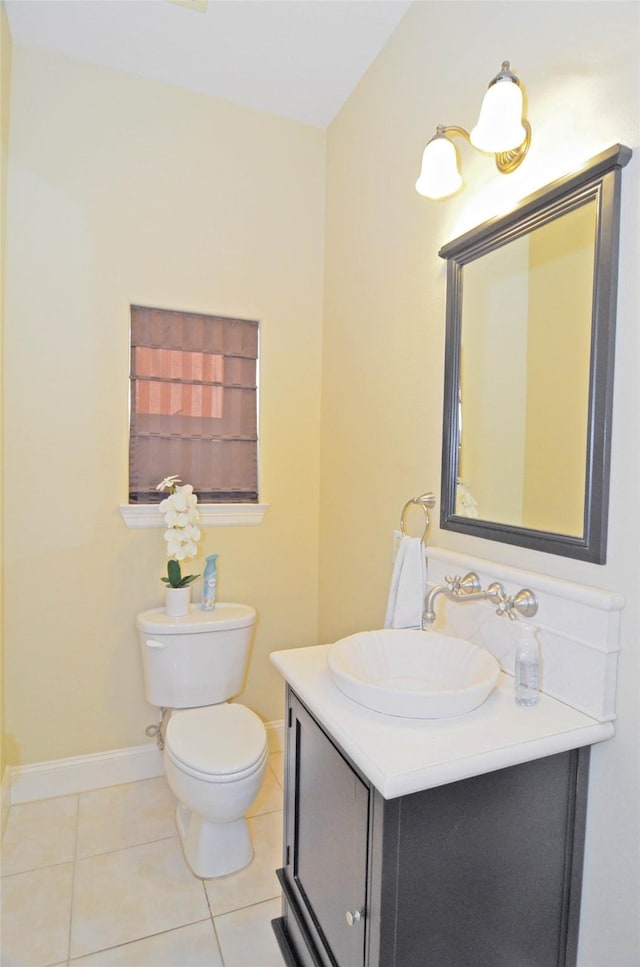 bathroom featuring vanity, toilet, and tile patterned flooring