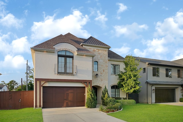 view of front facade with a front lawn and a garage