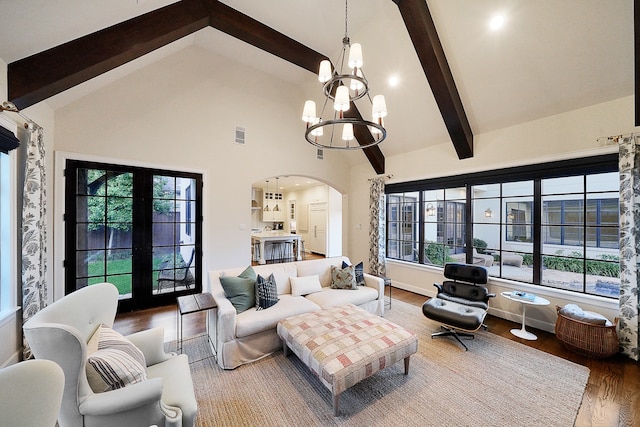 living room with high vaulted ceiling, french doors, an inviting chandelier, beamed ceiling, and wood-type flooring