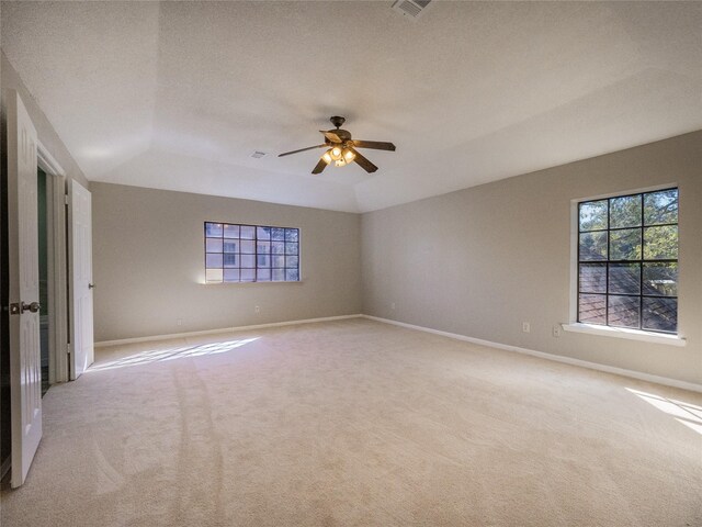 carpeted empty room with a textured ceiling and ceiling fan