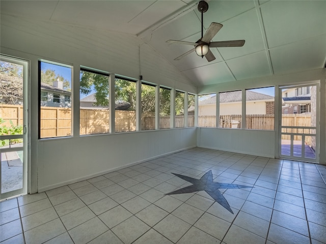 unfurnished sunroom with ceiling fan and vaulted ceiling