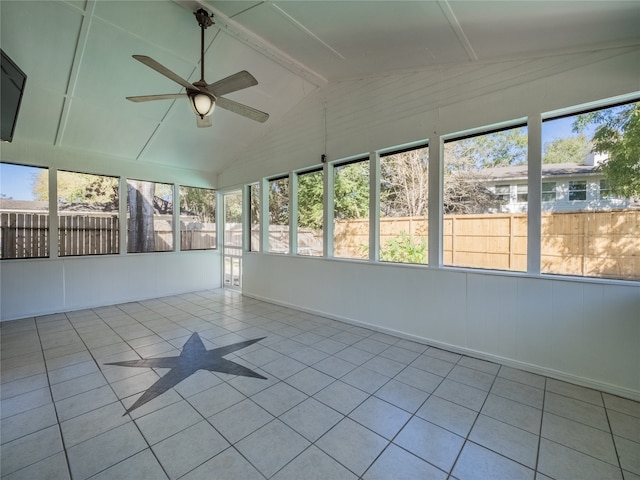 unfurnished sunroom with lofted ceiling with beams, a healthy amount of sunlight, and ceiling fan