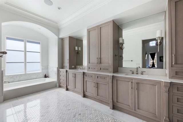 bathroom with a tub to relax in, crown molding, tile patterned flooring, and vanity