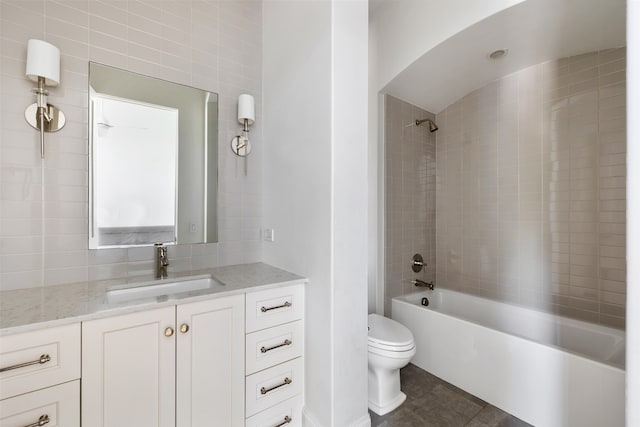 full bathroom with tile patterned floors, vanity, toilet, and tiled shower / bath