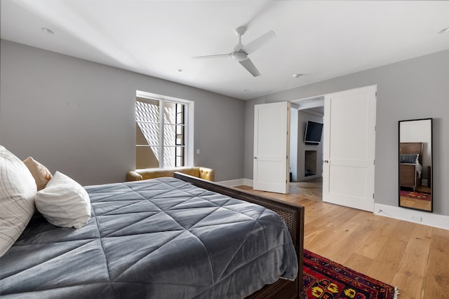 bedroom featuring ceiling fan and hardwood / wood-style floors