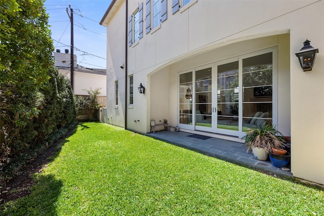 view of yard with french doors