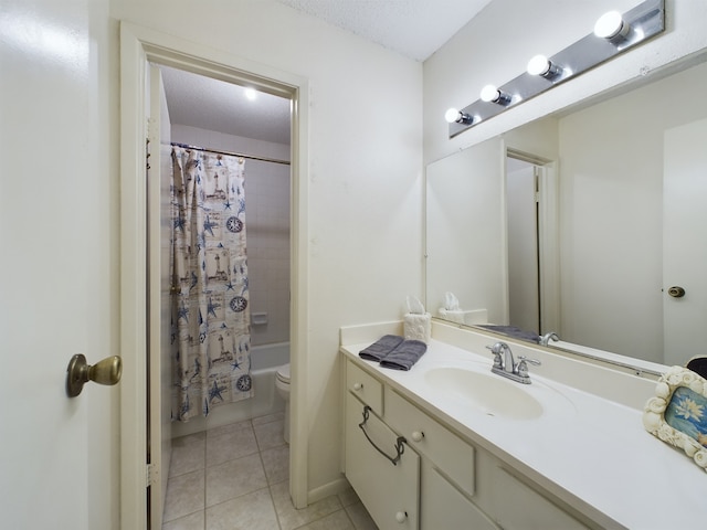 full bathroom featuring tile patterned floors, shower / bath combination with curtain, a textured ceiling, toilet, and vanity