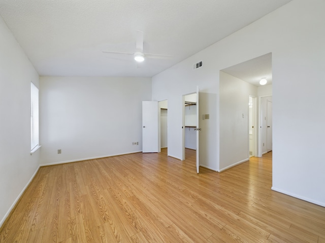 spare room featuring ceiling fan and light hardwood / wood-style floors