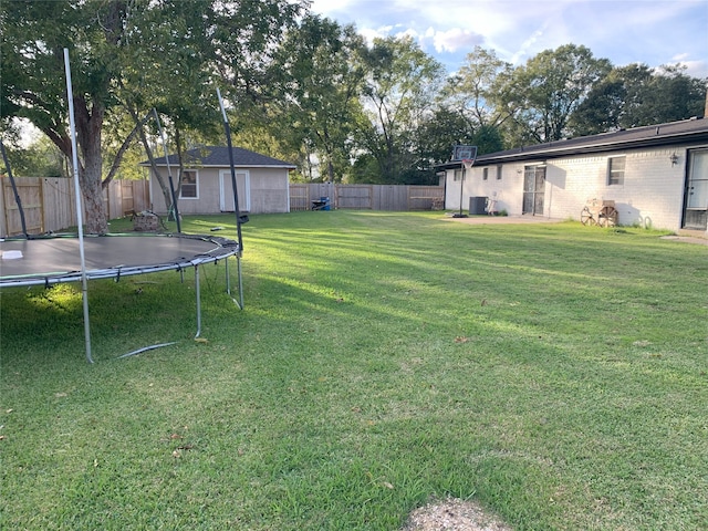 view of yard featuring a trampoline