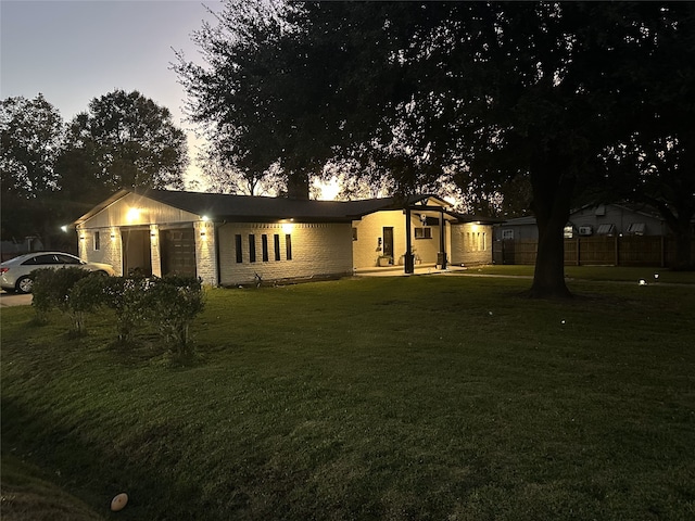 ranch-style house with a lawn