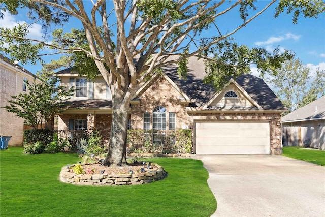 view of front facade featuring a garage and a front lawn