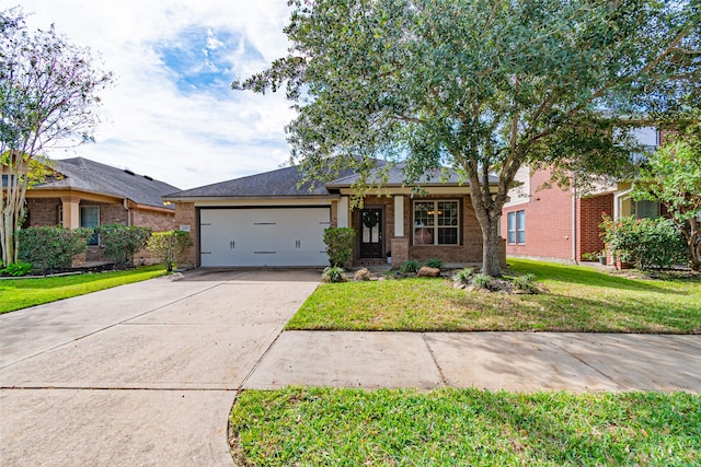 view of front facade with a front lawn and a garage