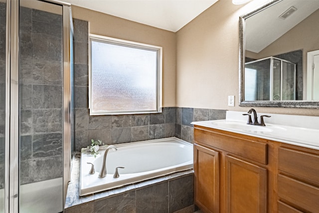 bathroom with plus walk in shower and vanity