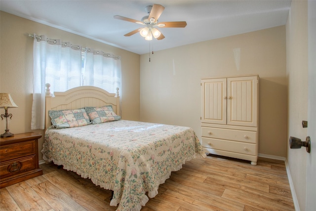 bedroom featuring light wood-type flooring and ceiling fan