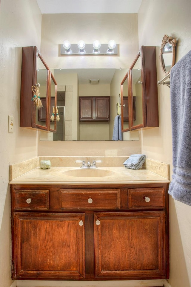 bathroom with visible vents and vanity