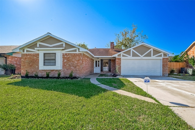 view of front of house with a garage and a front lawn