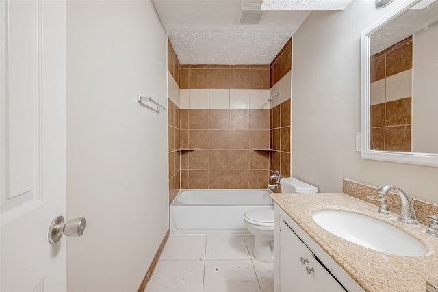 full bathroom featuring vanity, a textured ceiling, tiled shower / bath combo, tile patterned flooring, and toilet