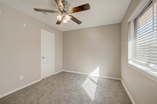 unfurnished bedroom with ceiling fan, carpet floors, and a closet