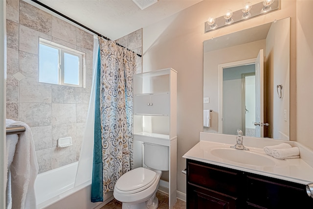 full bathroom featuring a textured ceiling, vanity, toilet, and shower / tub combo with curtain