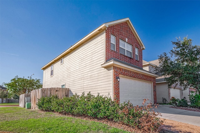 view of side of property with a garage