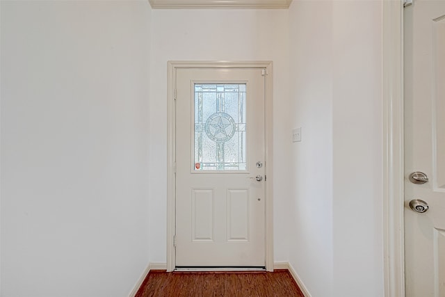 entryway featuring dark hardwood / wood-style flooring and ornamental molding