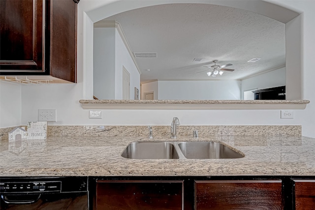 kitchen featuring dishwasher, sink, ceiling fan, a textured ceiling, and beverage cooler