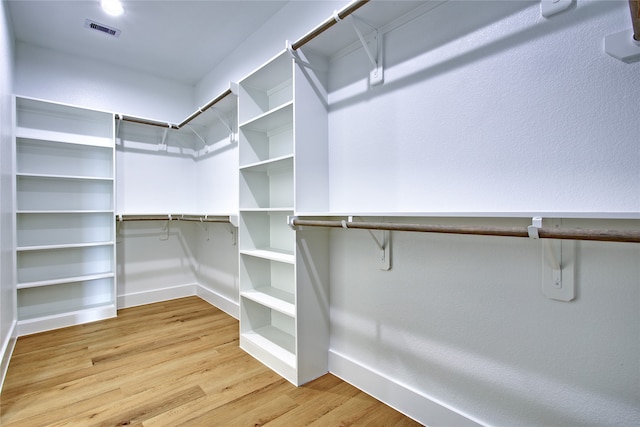 walk in closet featuring wood-type flooring