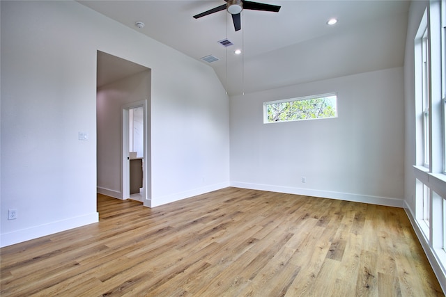 unfurnished room featuring ceiling fan, light hardwood / wood-style flooring, and lofted ceiling