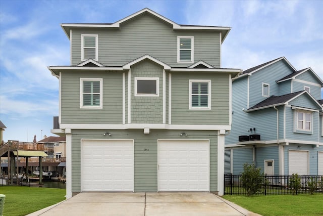 front facade with a garage and a front yard