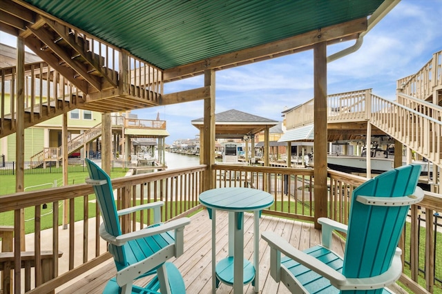 deck featuring a water view and a boat dock