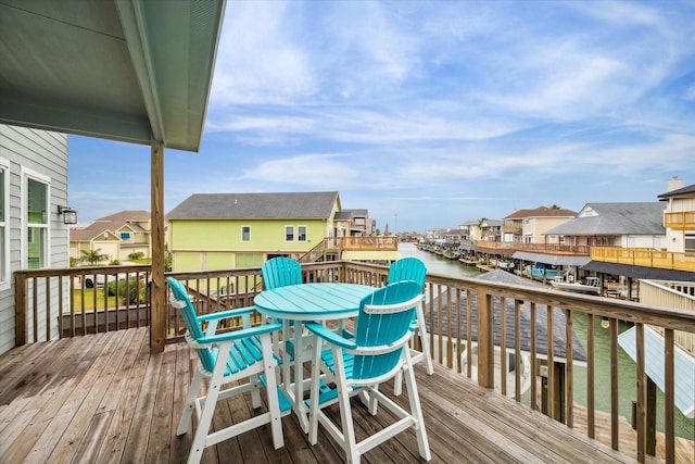 wooden deck featuring a water view