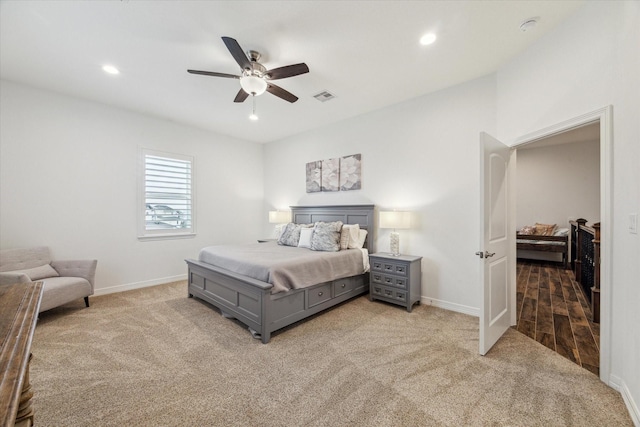 bedroom featuring ceiling fan and light colored carpet