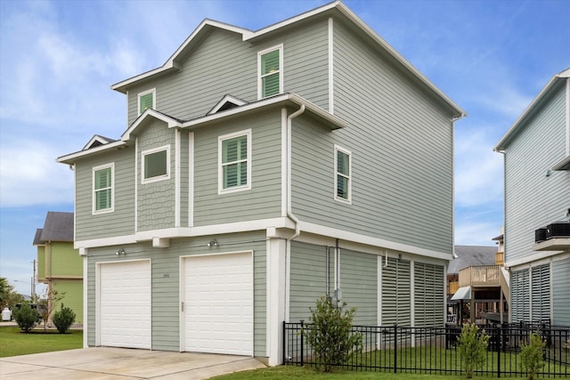 back of property featuring a garage