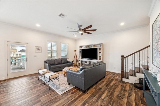 living room with dark hardwood / wood-style floors, ceiling fan, and crown molding