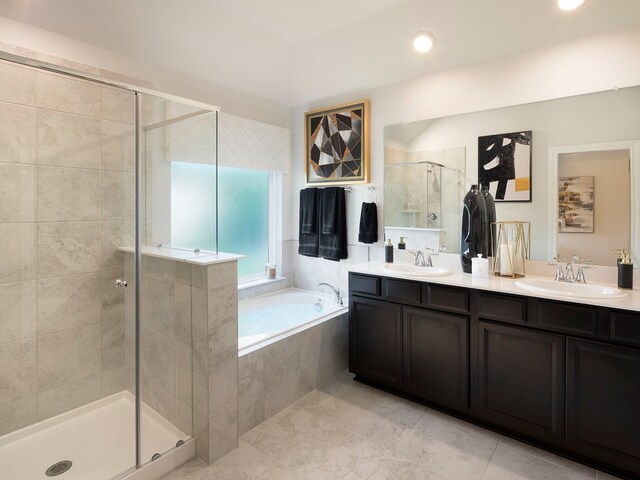 bathroom with plus walk in shower, vanity, and tile patterned floors