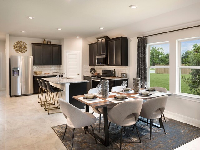 dining space featuring sink